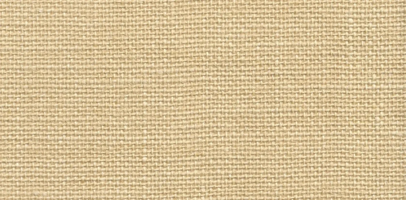 Close-up of a pale cream jute wallcovering with a fine, open basket weave