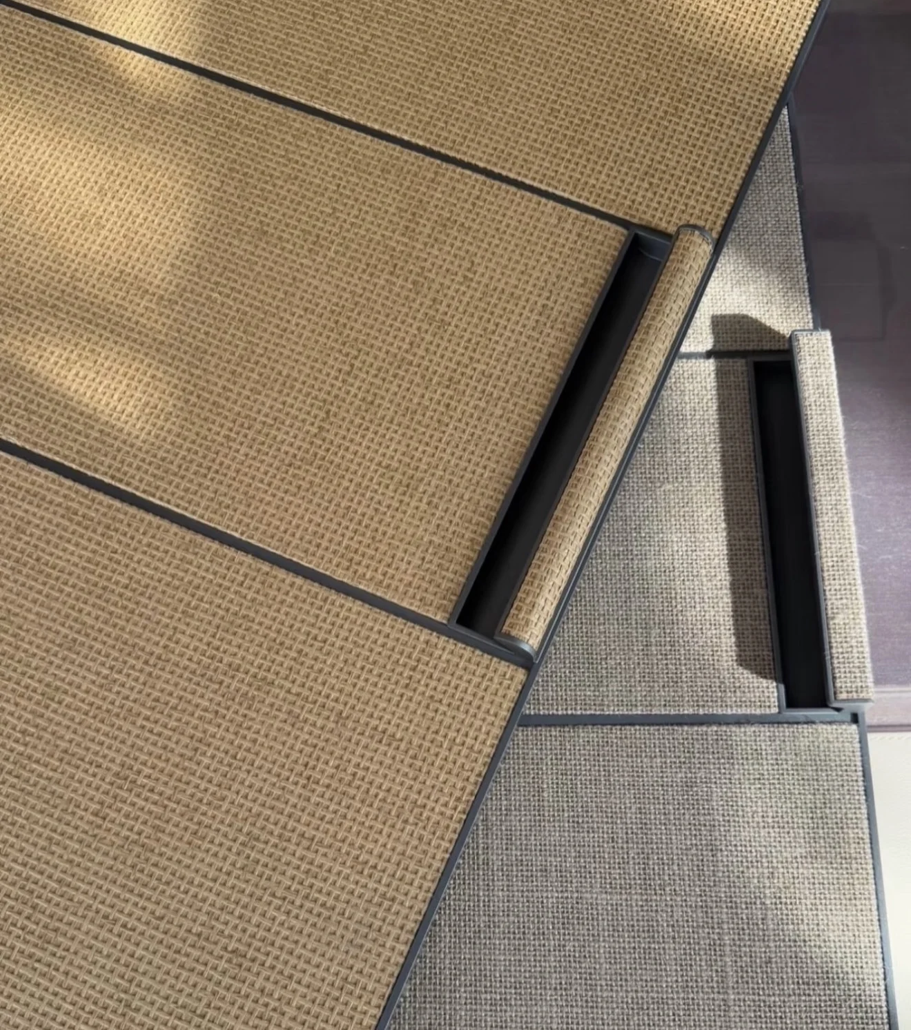 Further framed furniture panels showing tan and grey woven wallcovering surfaces